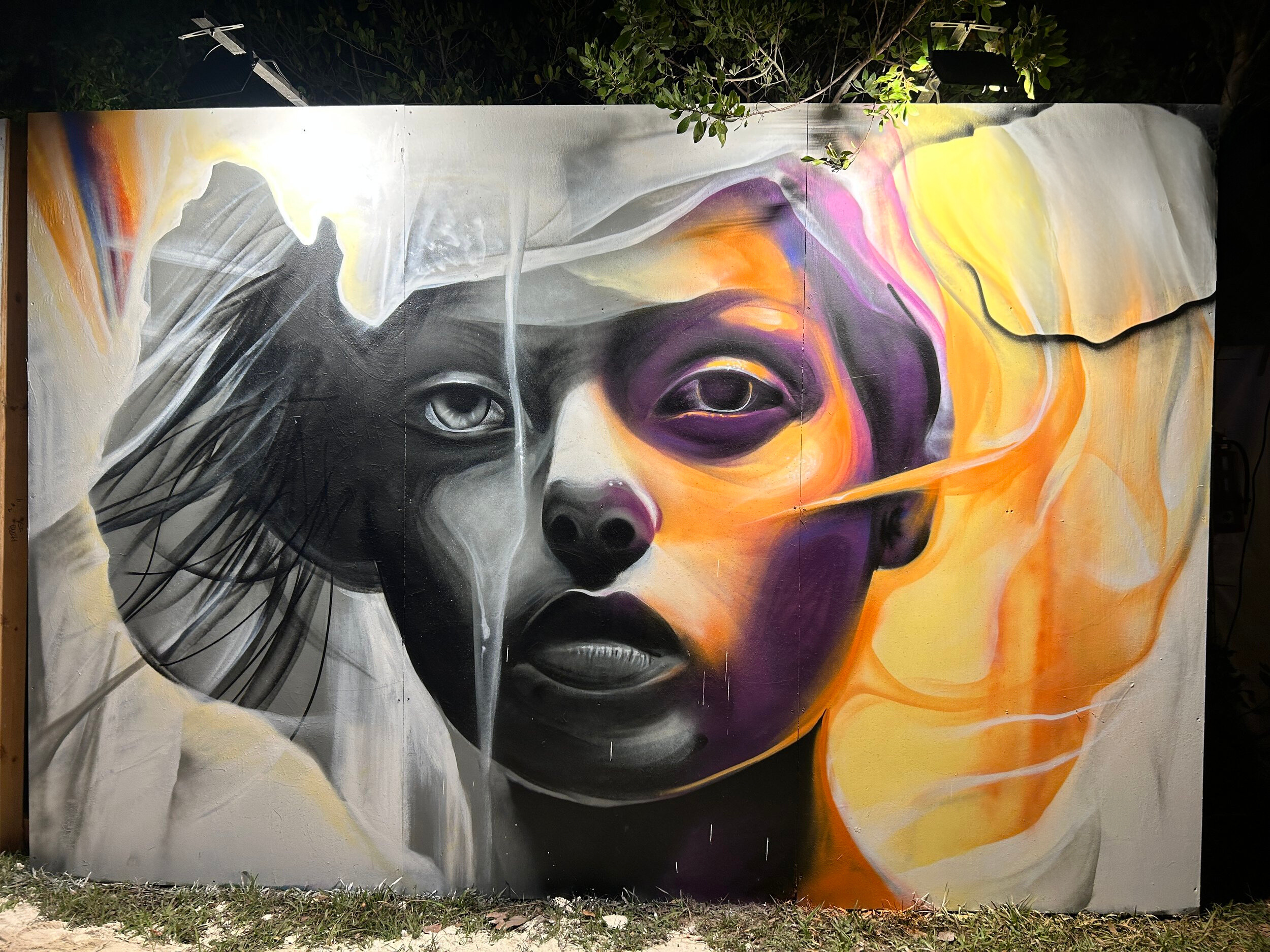 Art With Me — greyscale and amber portrait mural on an exterior wall, Miami, Florida