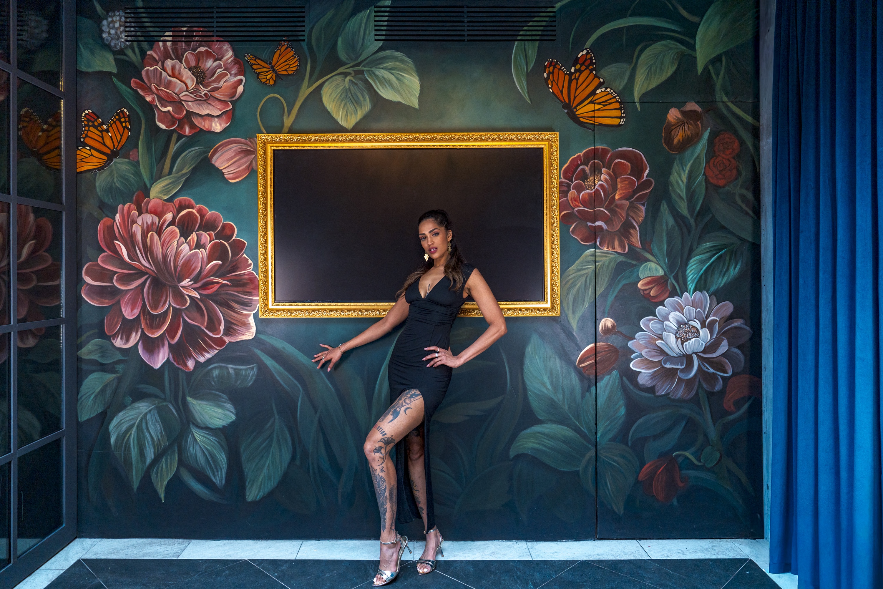 Floral — dark botanical mural with peonies, butterflies and a gold frame in Tulum, Mexico