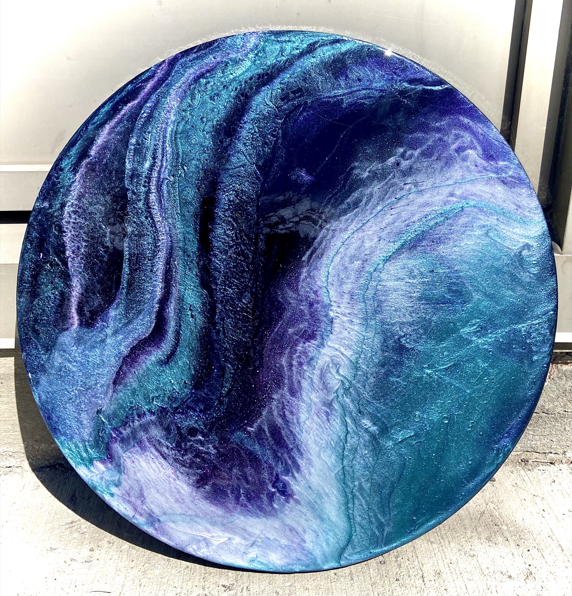 Round resin artwork in deep lapis, violet and white by Faith the Creator